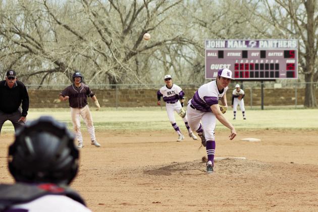 Joe Valdez fires a strike in a ball game against John Mall. Photo by Karen Rochester