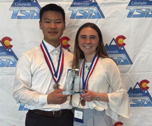 Adin Poehlein and Ozzira Garrison with their first-place trophy and medals Courtesy Photo