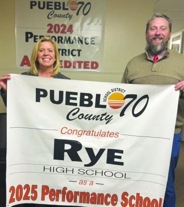 Rye High School Principal Matt DeJong and Craver Middle School Principal Jody Pool with Superintendent Ronda Rein (L) proudly display the banners awarded to Craver Middle School and RHS. Courtesy Image