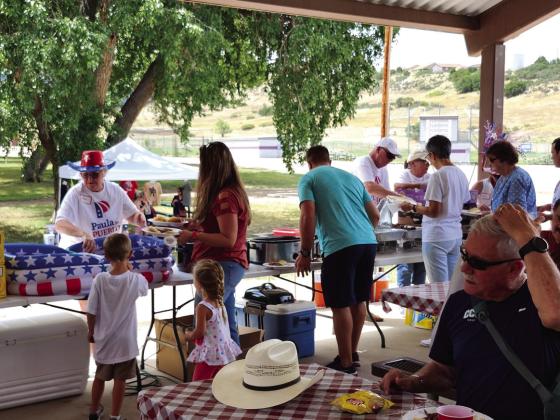 The serving line of the Paula for Pueblo BBQ worked by Volunteers for Paula. Photo by Shirley Pigg