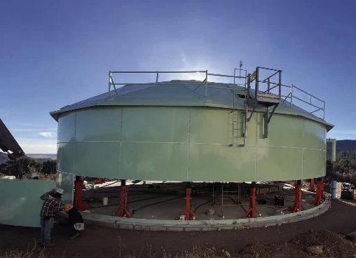 The new tank rises. The top was constructed first, then each subsequent layer added by jacking up the completed segments and assembling the next rank beneath Courtesy Photo