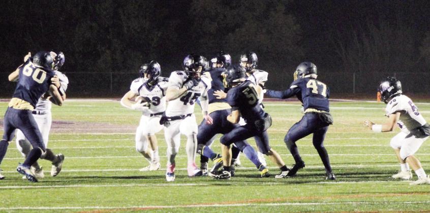 Caleb Hurne #45 leads brother Dylan Hurne #33 through a gaping hole off right tackle in Rye’s Homecoming victory over CSCS. Photo by Karen Rochester