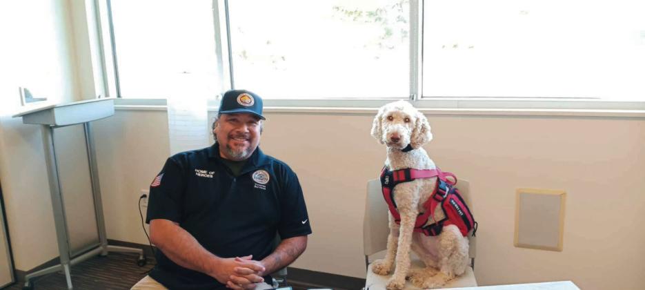 Eric Moncibais, Pueblo Veteran Service Officer, and his companion dog, Jade offered information and resources for veterans at the Veteran Benefits Fair on Saturday, September 27. Photo by Shirley Pigg