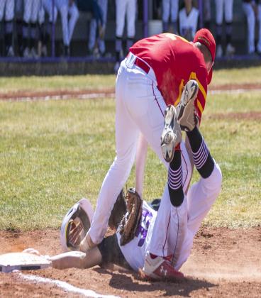 Rye got on the board right away during its first game of a double-header with Rocky Ford on a beautiful spring afternoon, beating the Meloneers 7-0 and gave up only 1 run with an 11-1 win during game two. Xaden Ehrlich, #33, making sure he’s not called out during the TBolts first game on Saturday, March 26. Photo by Sue Barcus