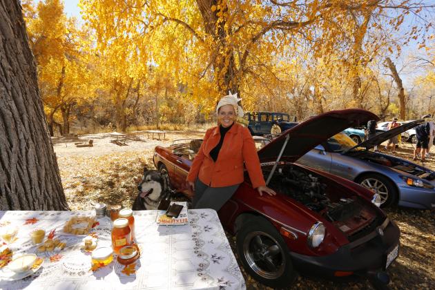 Queen Bee aka Gabriele Reed with her MGB British classic sports car. Linger Longer Bee N' Bee honey and natural products. Photo by Emily Colton San Isabel Photography