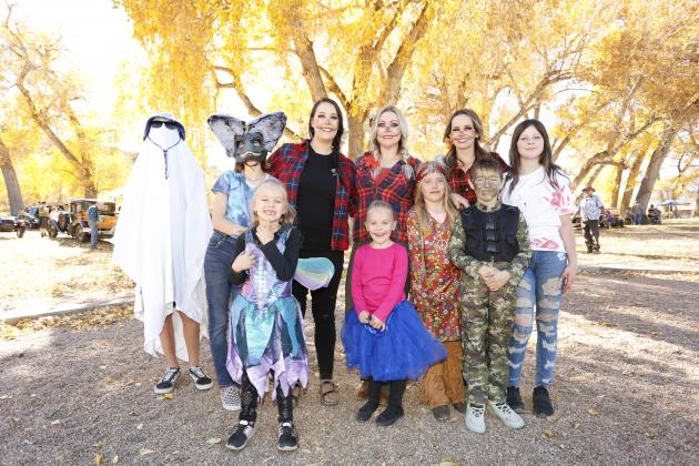 Friends gather in costume to celebrate Halloween at the Classic Car Show Trunk or Treat in Colorado City. Photo by Emily Colton of San Isabel Photography