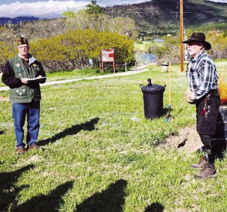 VFW Post 7305 officers Jerry Collins, Vice Commander (L), and Don Shumake, Chaplain (R), explain the ceremony to their audience. Courtesy Photo