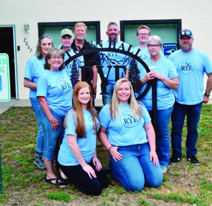 Rye Mayor Marty Rahl ( second from right), Trustees of the Town of Rye, and volunteers gather at the Rye Town Hall during the Town Square Fair. Courtesy Photo