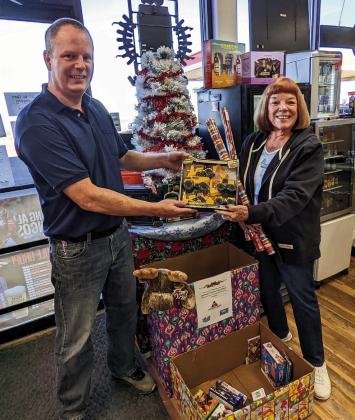 Fast Break Manager Jon Hendry and Colorado City/Rye Lions Club Treasurer Donna Walker-Hulben team up to collect toys for area children again this Christmas season. Photo by Deb Straub