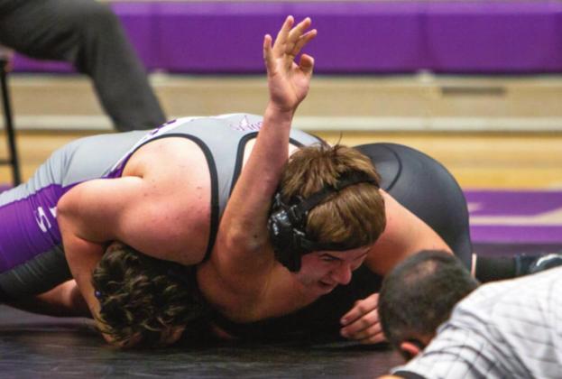 Devin Samuelson wrestling at 220 on Friday night, Dec. 17, during a dual meet with John Mall and Mancos H.S. pinned his opponent from John Mall. Photo by Sue Barcus