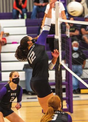 Rye's lady T-Bolts made a comeback in the 3rd and 4th games against The Vanguard School with 25-21, 25-11 scores, but lost to Vanguard 10-15 in the 5th game for a 2-3 loss. Sophomore #12, Jordan Holgerson slamming the Courser's defense with another hard hit. Photo by Sue Barcus