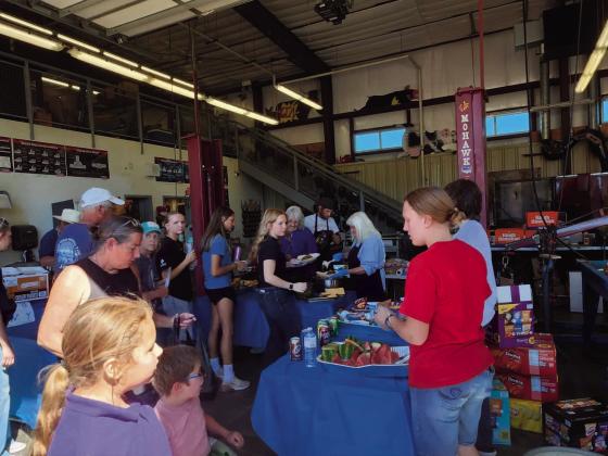 The famous FFA BBQ was a busy place as FFA members and volunteers served meals. Photo by Shirley Pigg