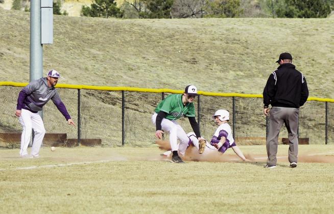 RHS Baseball playerJoe Valdez, as Coach Graham tells him to 'Get Dirty' ,coming into 3rd at the March 14, St. Mary’s High School contest. Photo by Karen Rochester