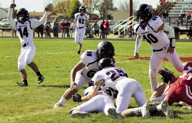 #14, Cole Cooper celebrates as his on-side kick is recovered by #23, Josh George. Photo by Karen Rochester