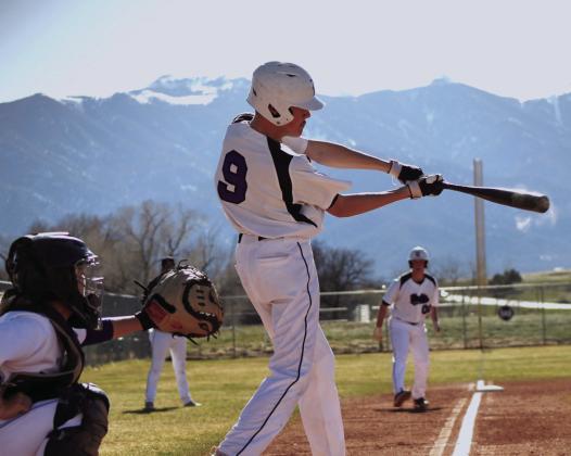 Rye High School Junior Varsity #9 Wyatt Scheid with a hit to bring #00 Grant Clennin in for a run. Photo courtesy of Karen Rochester