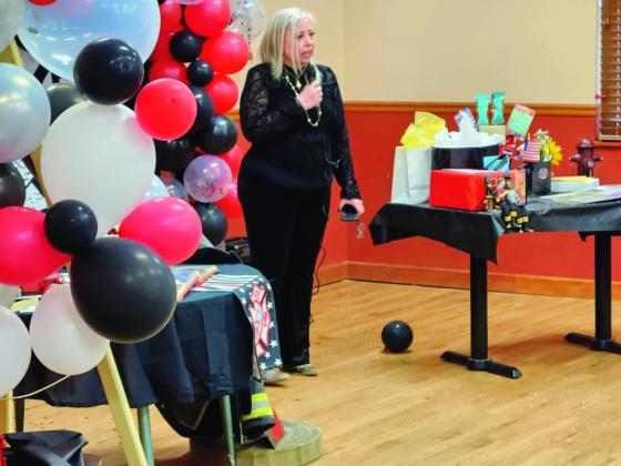 Sara Blackhurst spoke of her family's gratitude for Fire Chief Steve Bennett's devotion and skill at a retirement party for Bennett on April 12. Photo by Shirley Pigg