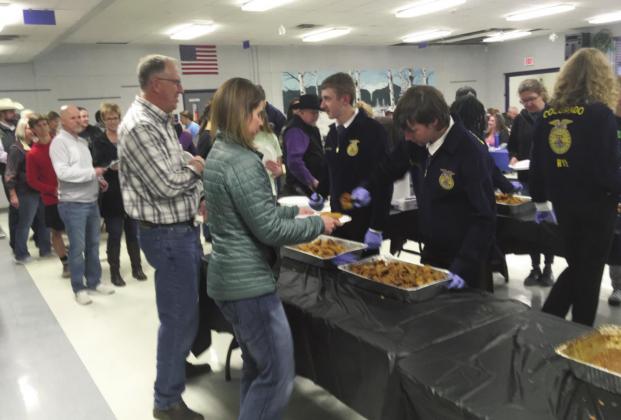 Rye High School Future Farmers of America members serve valley residents at the much-anticipated oyster fry and auction. Photo by Shirley Pigg