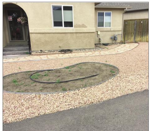Still in progress, Clark’s front yard shows an area for flower beds with drip-irrigation. Photo by Shirley Pigg