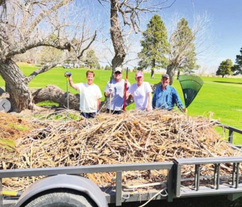 Friends of Hollydot volunteers clean up tree branches after a recent wind storm at the course. Courtesy Photo