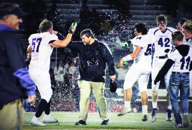 Devin Samuelson #57 makes sure Head Coach Connor Pigg celebrates Rye’s first league championship since 2010. Photo by Karen Rochester