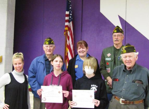 The Craver Middle School Patriot’s Pen Ceremony honors award winners and local veterans of foreign wars. L-R, teacher, Erin Sonnleitner; Veteran Tom Howard, student Miriam Peterson, Auxilliary President Toni Liebnow, stu dent Shiloh Rutledge, Veteran Jerry Collins, and Veteran Jimmie Porter. Photo by Shirley Pigg