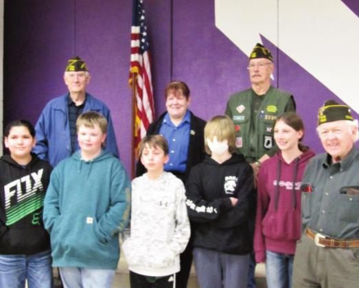 Patriot's Pen award winners and honorable mention winners pose with Auxilliary President Toni Liebnow and VFW Post #7305 officers (l-r) Tom Howard, Jerry Collins, and Jimmie Porter. Courtesy Photo
