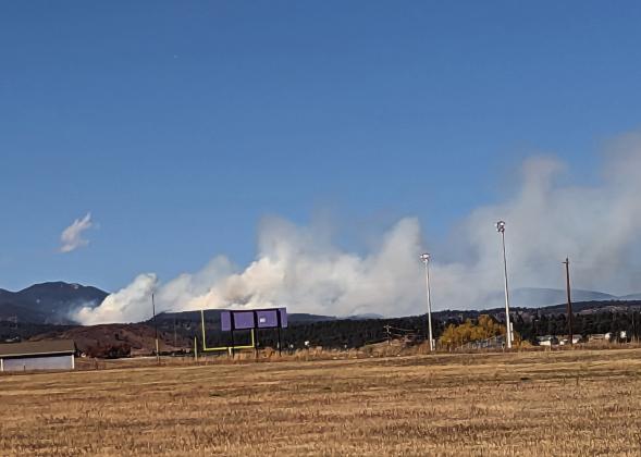 Smoke from the St. Charles Fire is visible to the north and west of Rye High School. Photo courtesy of Deb Straub