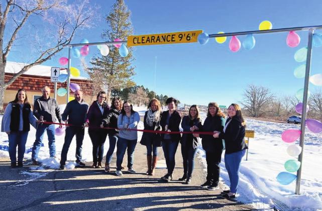 Celebration of a new drive-thru banking option at Bank of the San Juans was well attended at the Saturday morning ribbon-cutting. The Greenhorn Valley Chamber of Commerce, bank patrons, and bank personnel came out to commemorate the event: left to right are Aimee Keys, Willy Faris, Brian Prichard, Melissa Pye, Lacey Briggs, Kourtny Quillen, Terry Baughman, Karen Davis, Jackie Galli, Stacey Harner and Kelsi Baldwin. Courtesy Photo