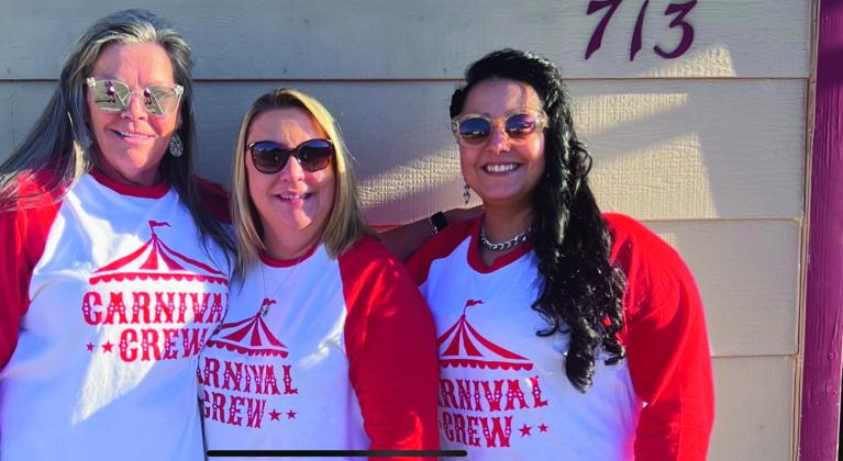 Samantha Kolbensfetter (L), Janice Salapich, and Jennifer Lopez of Farm Bureau in Walsenburg pause from their annual Carnival Crew celebration. Salapich and her team put together the event for local children at Halloween. Courtesy Photo