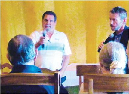 Jim Eccher (L), Colorado City District Manager, and Zach Swearingen, Pueblo County Commissioner, listen intently to a resident's concerns at the Town Hall Meeting held on September 14, at the Three Sisters Tavern and Grill. Photo by Shirley Pigg