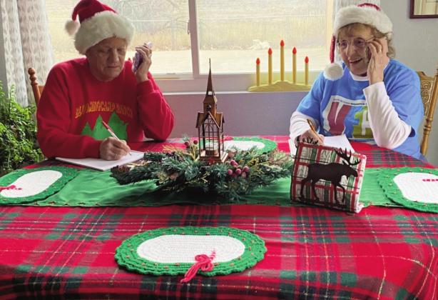 VFC elves double checking the names of children on their Santa list! Courtesy Photo