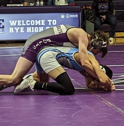 Logan Jones, Rye High School, has a good hold on his Trinidad opponent. Photo by Deb Straub