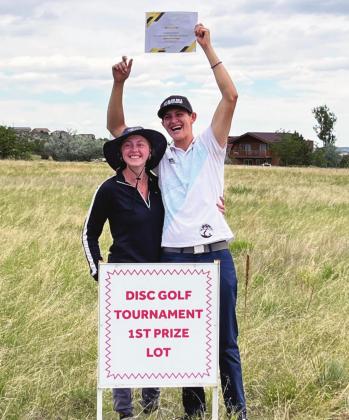 Cristian Jojola and his number one fan look over the Colorado City property that he won in the first Darren Butcher Memorial Disc Golf Tournament. Courtesy Photo