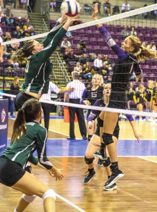 Sophie Adamson #1 stopping Holyoke from slamming the ball back over to their side at State playoffs. Photo by Sue Barcus