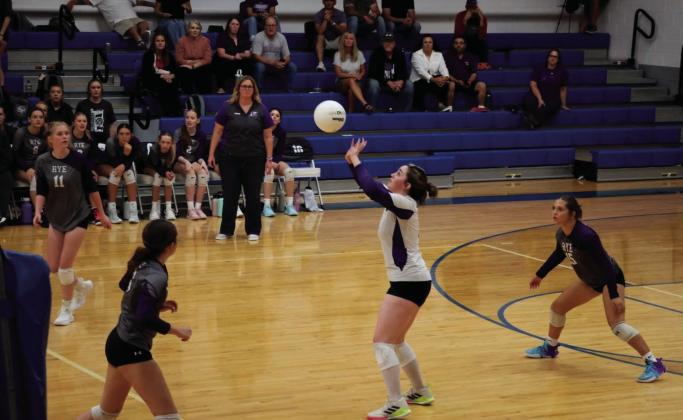 Olivia Donlon, #11, and Kaylee Walton at the net, wait for the set from Seine Roy while Glorianna Ruiz looks on. Courtesy Photo