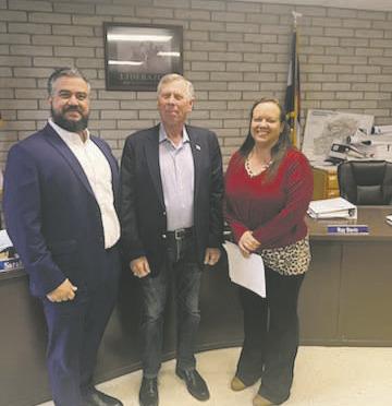 Courtesy Photo New members of the Colorado City Metro District were sworn in on May 7th. Pictured left to right are new board member Abdel Ayoub, new board member Bob Sievert, and Kourtney Quillen, Bank of the San Juans manager, who performed the swearing in. Both board members were appointed to a four-year term