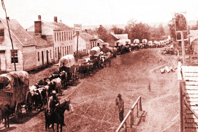I Paola Miami Kansas. Wagon trains were often compiled of wagons driven by the women and carrying the children, with the men riding on horseback to scout ahead. Courtesy Photo