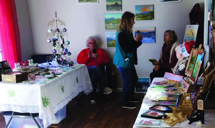 Shoppers enjoy being able to visit with the crafters and vendors during the Rye craft fair. Photo by Shirley Pigg