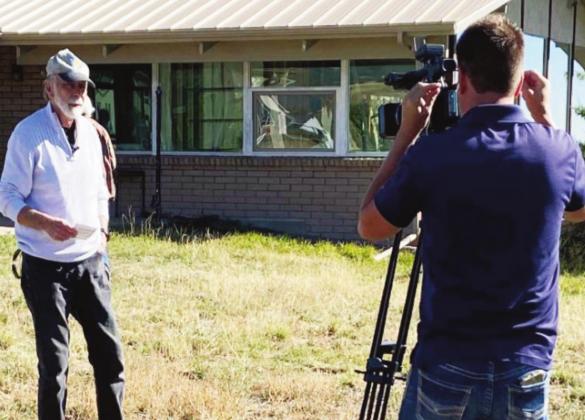 Volunteers for Community board member Tom Corlett talks about making the remodled community center energy efficient. Photo courtesy of Bobbi Highberger