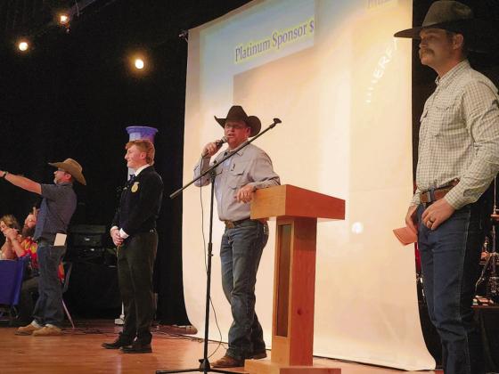 Cody Scheid was the auctioneer for the FFA labor auction with assistance from John Christenson and Turner KinKaid. (L-R) John Christenson, RHS FFA member Branson Burbidge, Cody Scheid, and Turner KinKaid. Photo by Shirley Pigg