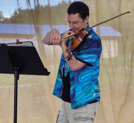Phil Hassey brought out his fiddle for the talent show. Photo by Shirley Pigg
