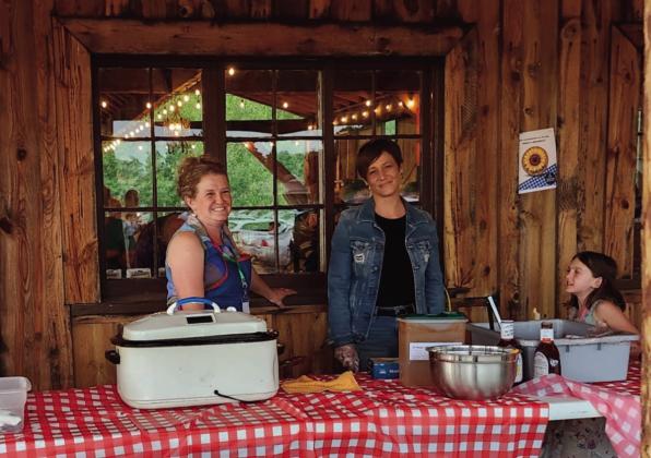 Volunteers cheerfully served a mouth-watering smoked brisket dinner at the Faith Circle's Mountain Aire Festival Photo by Shirley Pigg