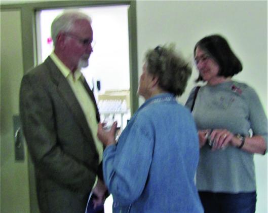 CCMD Board of Directors Incumbent Neil Elliot speaks to residents. Photo by Shirley Pigg