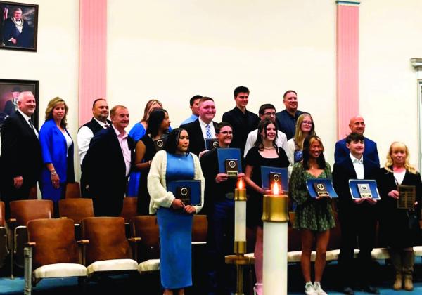 Following the awards ceremony, the recipients posed with their school representatives. Michelle Mann-Madril was on hand to see Dodge and Kirk receive their awards. Courtesy Photo