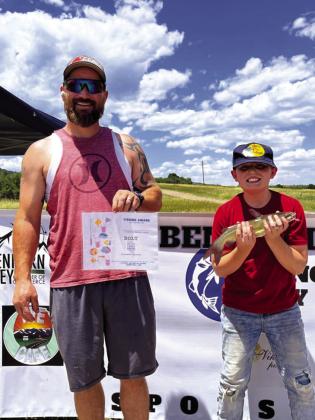 Jaxson Otto (R) poses with his 16 inch cat fish that won him a first place prize in the Greenhorn Valley Chamber of Commerce's Reuben Espinoza Memorial Fishing Derby. Photo by Shirley Pigg