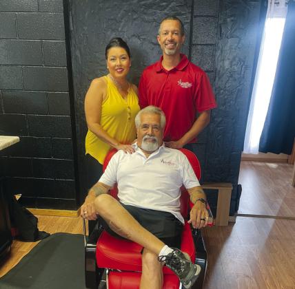 Owners/operators of Aguilar Family Hair Styling, center Louis Aguilar, left Stacie Barrett, right Carlos Barrett Courtesy Photo