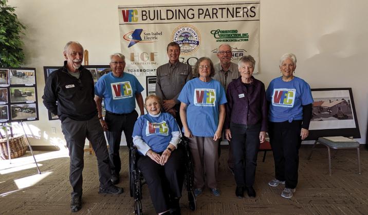 At the Susan Kalman Peaks to Prairie Community Center Grand Opening, a portion of the many who contributed time, labor and expertise to the project are (L-R) Tom Corlett, Harry Hochstettler, Susan Kalman, Larry Fogle, Judi Patrick, Robert Johnson, Terry Sanders and Gerri Nickel. Photo by Deb Straub
