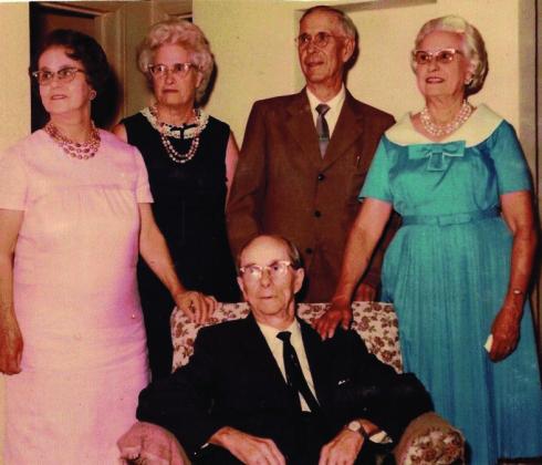 Larson Siblings: left to right Hallie Larson Nye, Nellie Larson Brunner, Jess, Mae Larson Dibble, seated, John Courtesy Photo