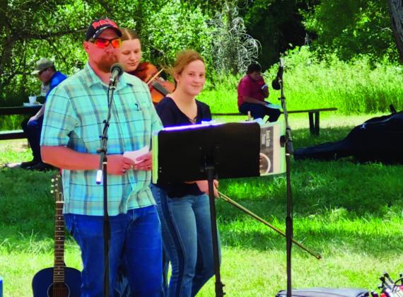 Jason Lovelace, Republican County Chairman for House District 46, welcomed everyone to the Taco Picnic on Saturday and introduced the candidates. See article on p. 6 Photo by Shirley Pigg