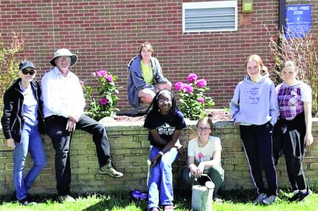 Paula and Dennis Maroney (L) lead the Rye High School Leos Club beautification project at Rye High School just before the 2023 graduation ceremony. Courtesy Photo